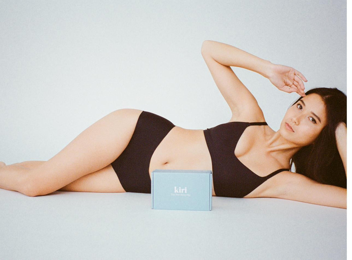 Model in Kiri period underwear lying beside the Kiri box