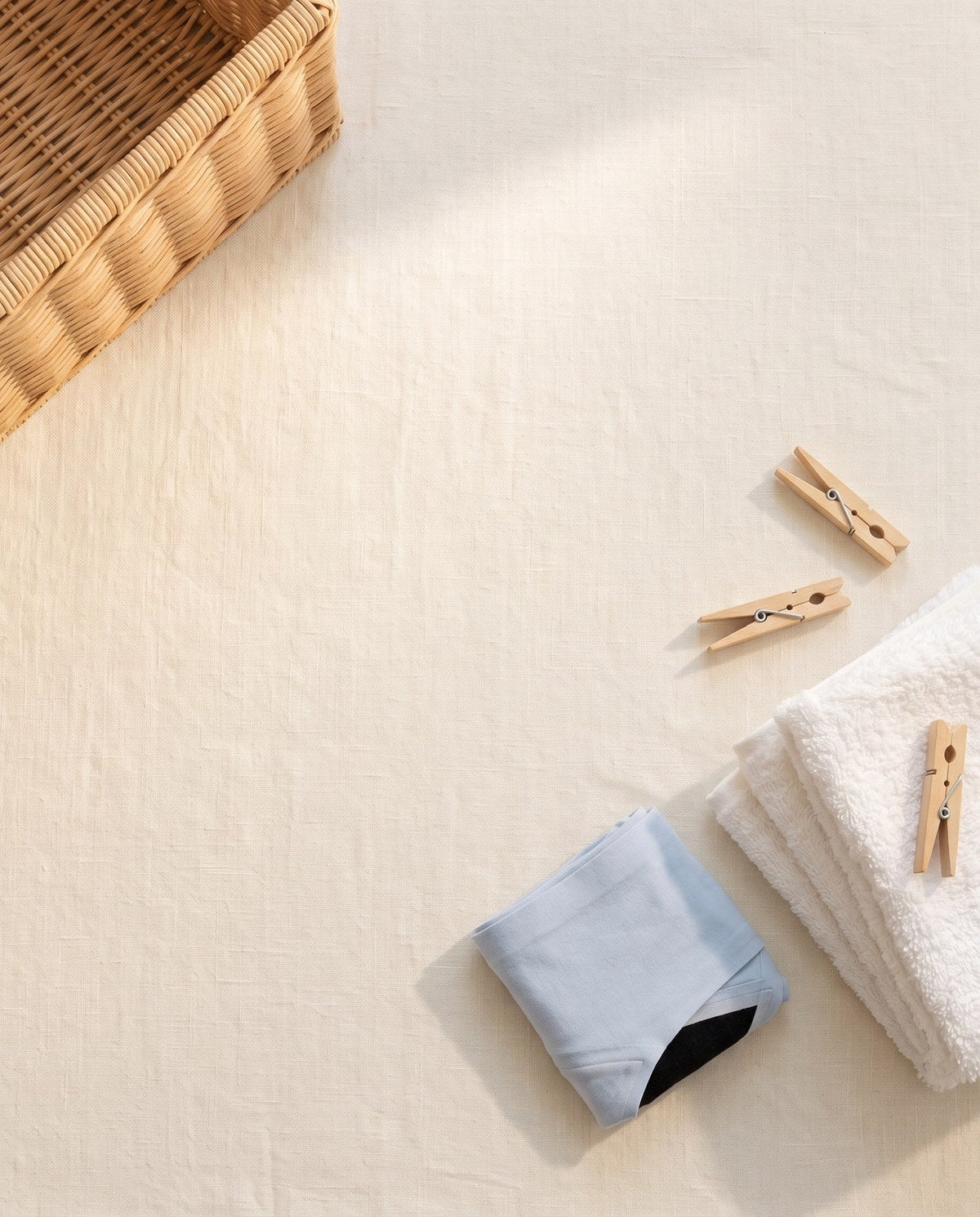 Kiri Celeste Blue period underwear with a towel and pegs, ready for a cold wash