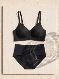 Kiri Selene Black bra with Selene Black nightwear period underwear as a set on travertine 6