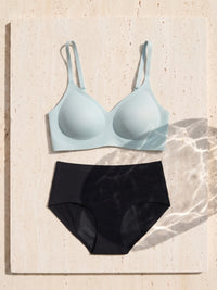 Kiri Brielle Blue bra with Selene Black nightwear period underwear as a set on travertine 6