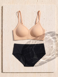 Kiri Charlotte Nude bra with Selene Black nightwear period underwear as a set on travertine 6