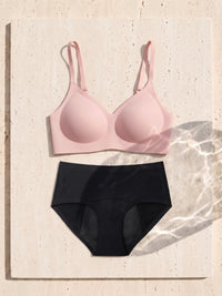 Kiri Heather Pink bra with Selene Black nightwear period underwear as a set on travertine 6