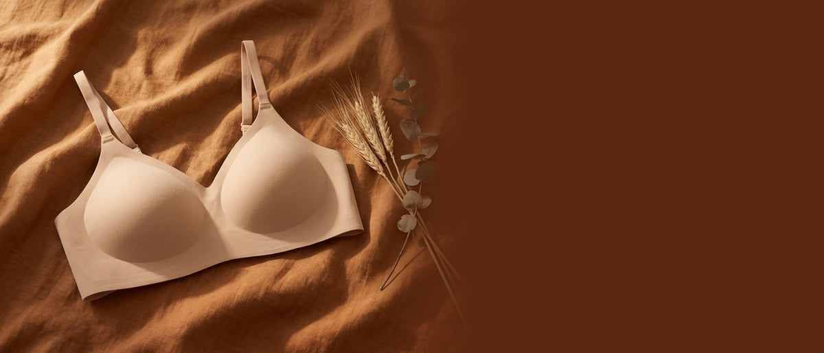 Kiri Charlotte Nude wireless bra on rust linen with wheat and eucalyptus