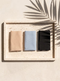 Three Kiri daily panties folded on a travertine tray 4