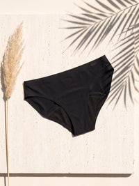Kiri Nisha Black daywear period underwear on pale travertine 7