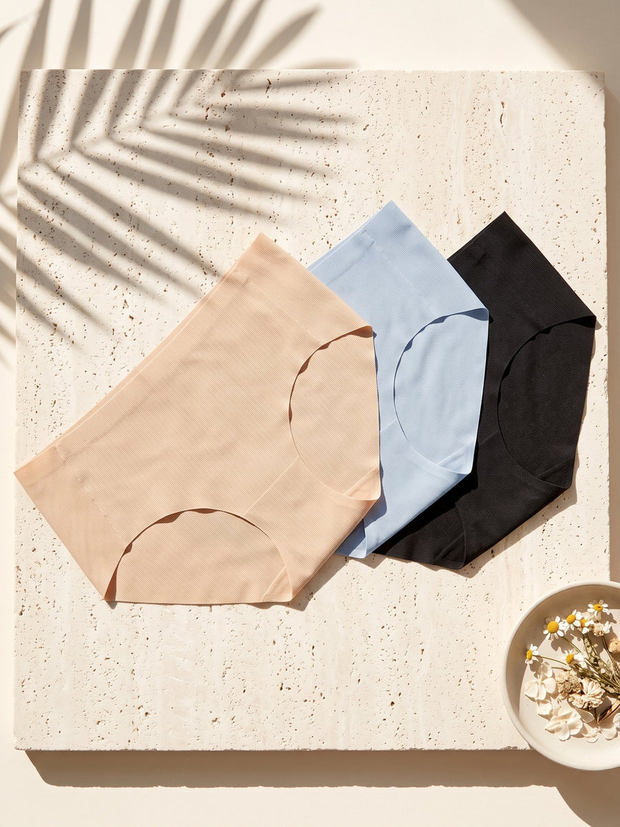Kiri daily panties in nude, blue and black fanned on pale stone
