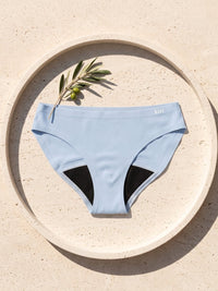 Kiri Celeste Blue period underwear on a round travertine tray 6