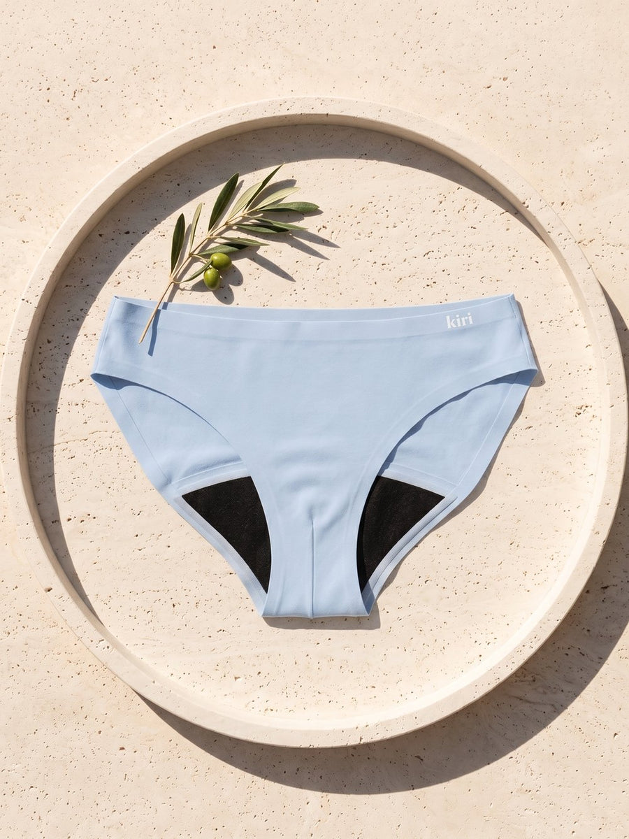 Kiri Celeste Blue period underwear on a round travertine tray