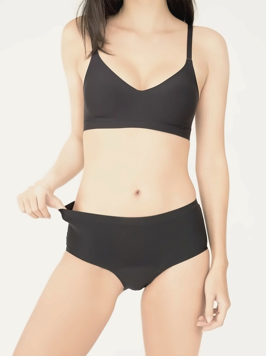 Model wearing the Selene Black bra with Selene Black nightwear period underwear